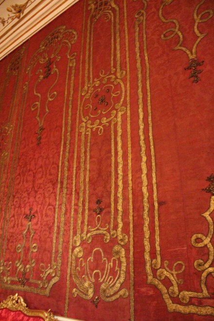 The original silk wall covering had seen better days, but the luxury was not lost.